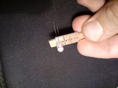 Vyrezana sablona z cuprextitu, velkost 36mm, stredna cas s LED ma 20mm a krajne casti na objimky maju 8mm kazda, sirka je 10mm